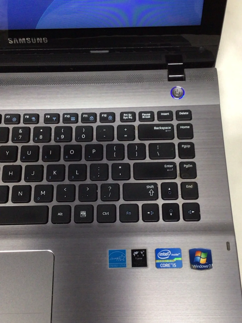 Samsung Silver and Black Laptop with Windows 7 Setup Screen